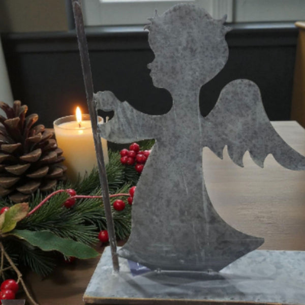 Angel holding candle